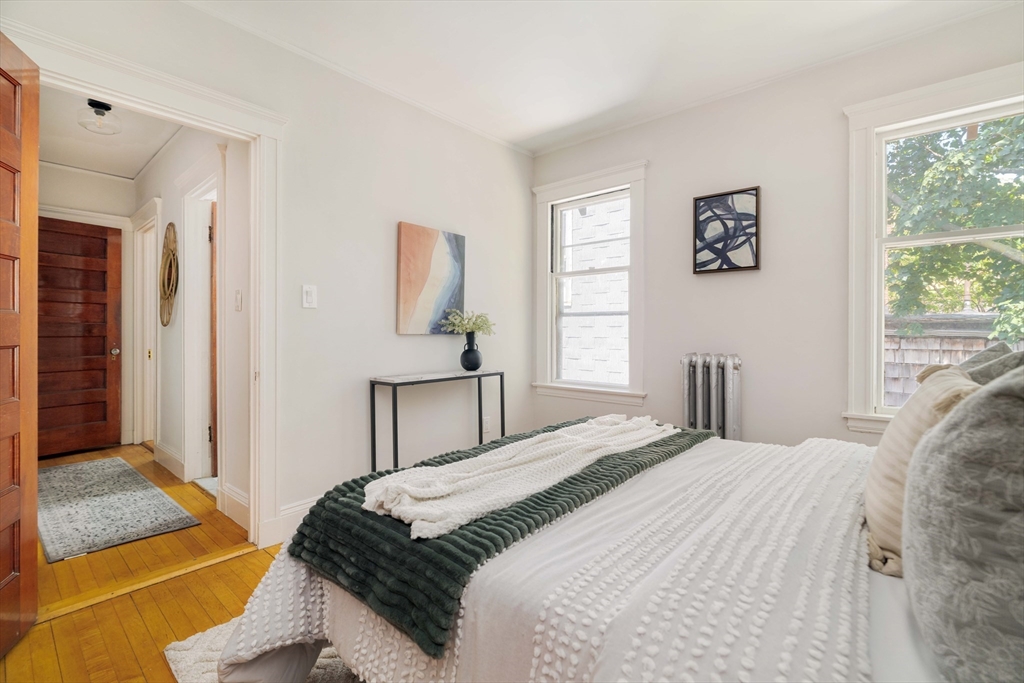 2 Clinton Street, Unit 37 Cambridge, MA 02139 - Photo 19 of 23 a bedroom with a bed and a window