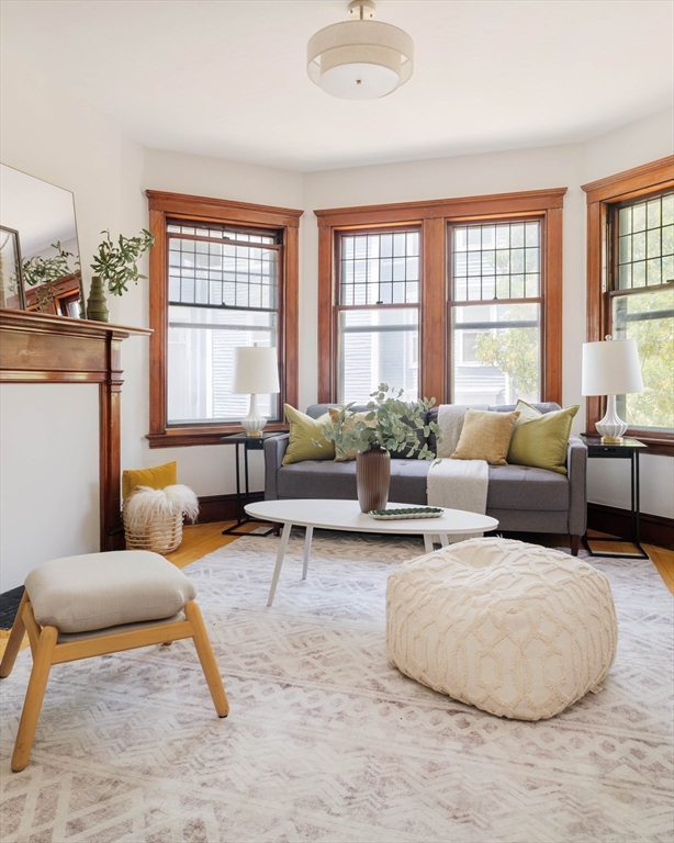 2 Clinton Street, Unit 37 Cambridge, MA 02139 - Photo 2 of 23 a living room with furniture and a large window