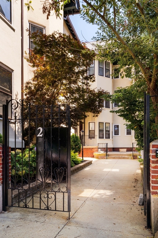 2 Clinton Street, Unit 37 Cambridge, MA 02139 - Photo 23 of 23 a front view of a house with a yard