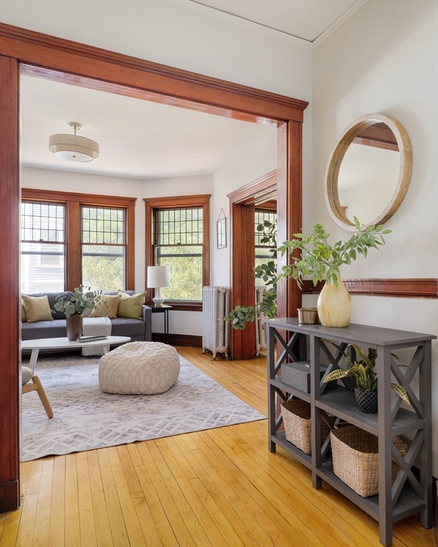 2 Clinton Street, Unit 37 Cambridge, MA 02139 - Photo 3 of 23 a living room with furniture and a large window