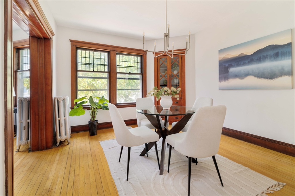 2 Clinton Street, Unit 37 Cambridge, MA 02139 - Photo 5 of 23 a view of a dining room with furniture window and wooden floor