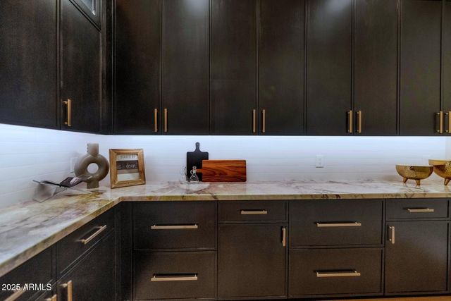 a kitchen with a refrigerator and a sink