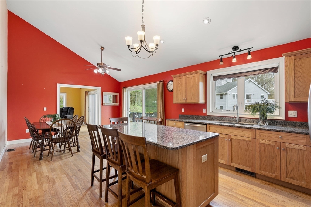 3 Brown Road Townsend, MA 01469 - Photo 12 of 41 a dining hall with stainless steel appliances granite countertop a kitchen island a stove a table and chairs