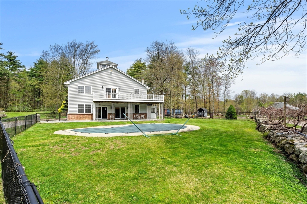 3 Brown Road Townsend, MA 01469 - Photo 22 of 41 a front view of a house with garden and trees