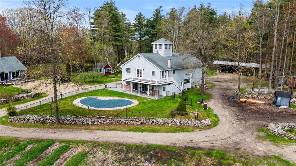 3 Brown Road Townsend, MA 01469 - Photo 23 of 41 a front view of a house with a yard and outdoor seating