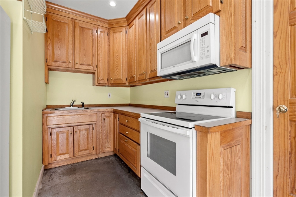 3 Brown Road Townsend, MA 01469 - Photo 24 of 41 a kitchen with stainless steel appliances granite countertop a sink and a microwave