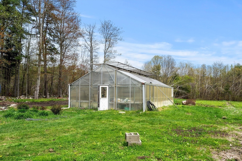 3 Brown Road Townsend, MA 01469 - Photo 40 of 41 a view of a house with yard and a garden