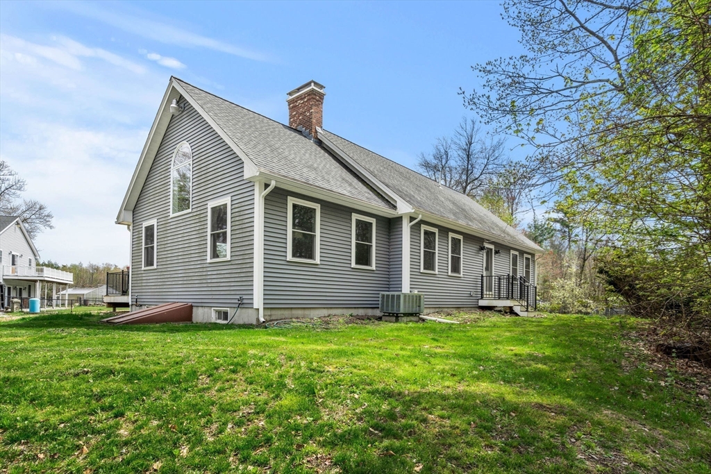 3 Brown Road Townsend, MA 01469 - Photo 8 of 41 a front view of house with yard and green space