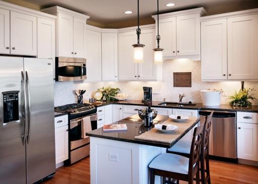13 Hunting Ridge Lane, Unit 7 Bethel, CT 06801 - Photo 1 of 1 a kitchen with stainless steel appliances a stove a sink a microwave a refrigerator and cabinets