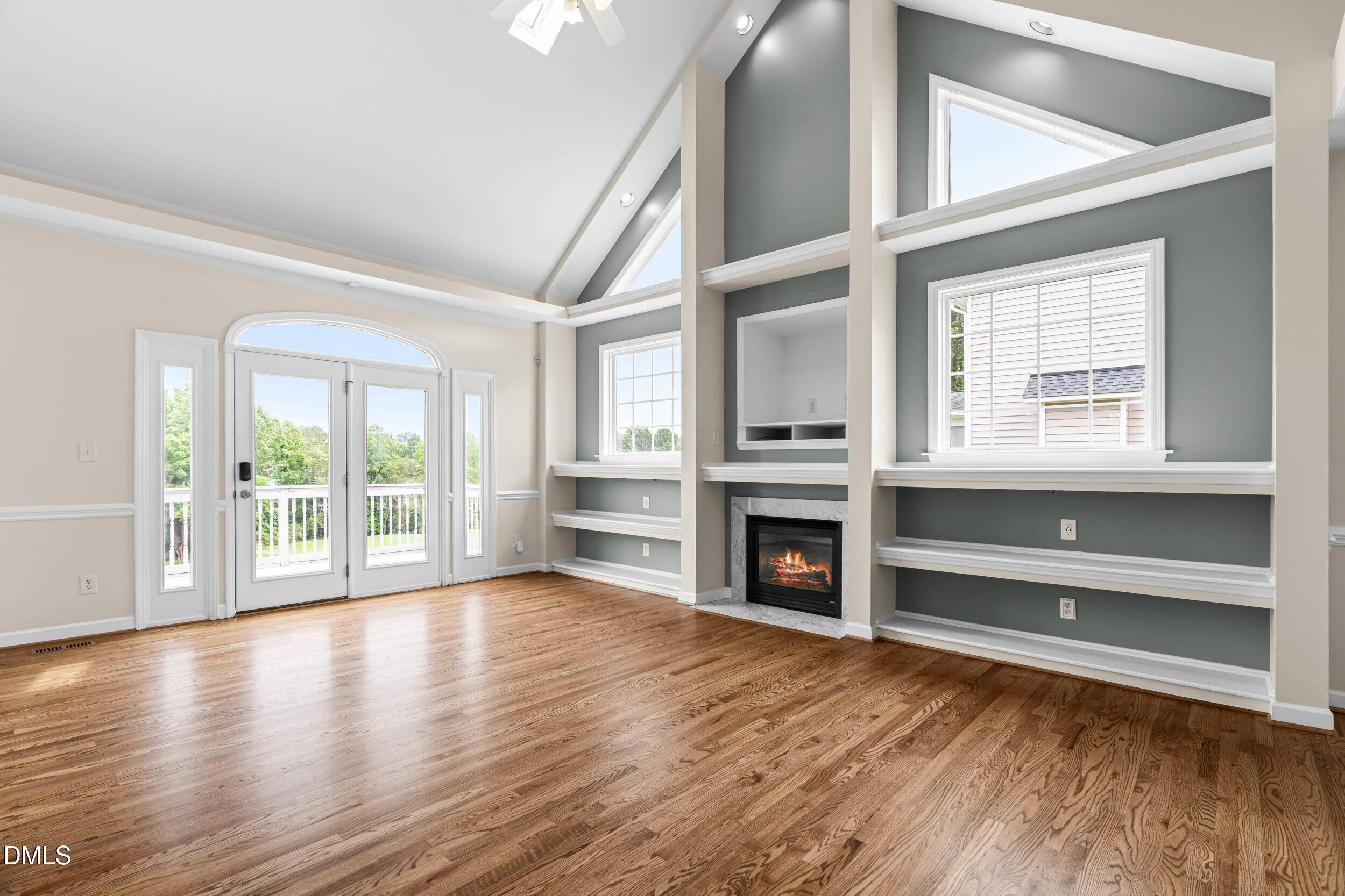 744 Seastone Street Raleigh, NC 27603 - Photo 6 of 53 wooden floor fireplace and windows in an empty room