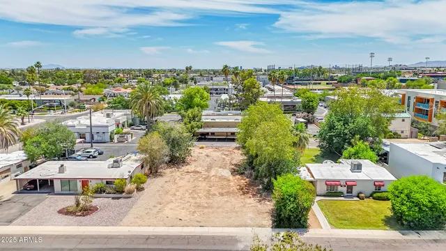 an aerial view of residential building and lake