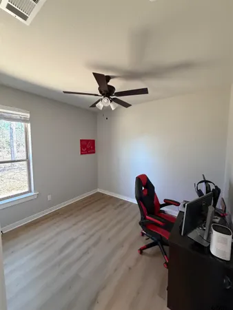 a workspace with furniture and wooden floor