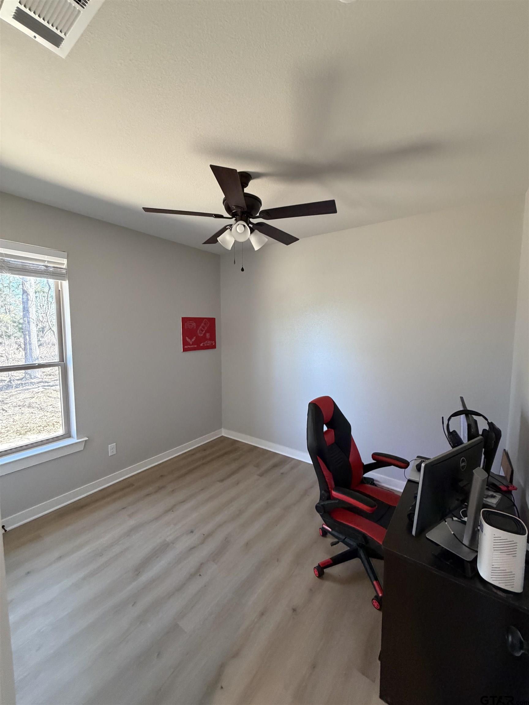 11201 County Road 166 Tyler, TX 75703 - Photo 14 of 19 a workspace with furniture and wooden floor