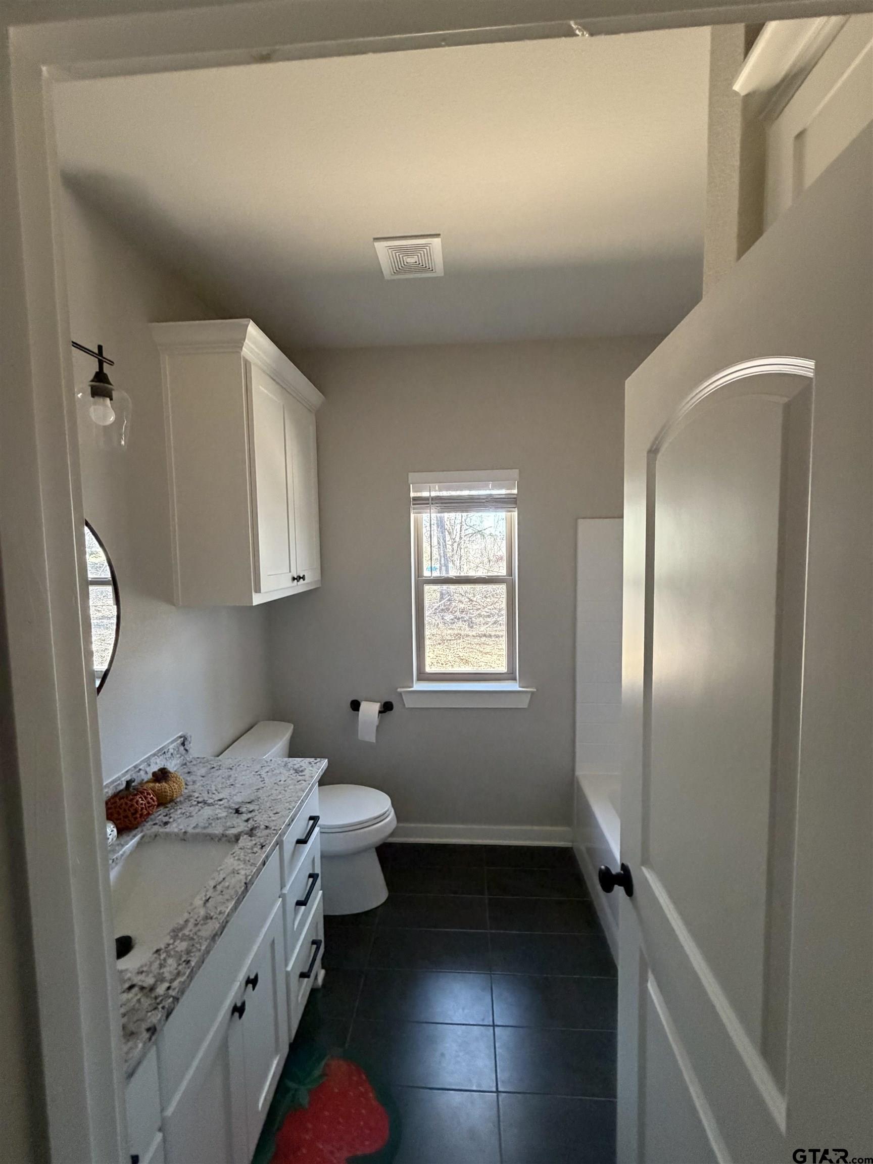 11201 County Road 166 Tyler, TX 75703 - Photo 15 of 19 a bathroom with a sink toilet and shower