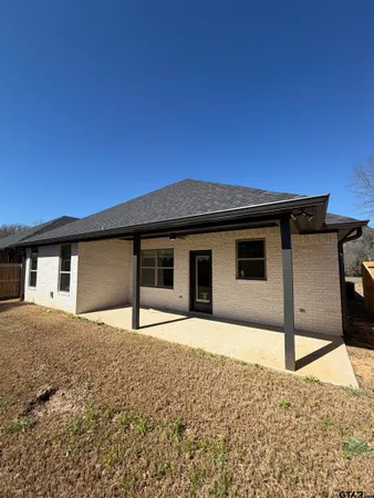 a house with trees in front of it