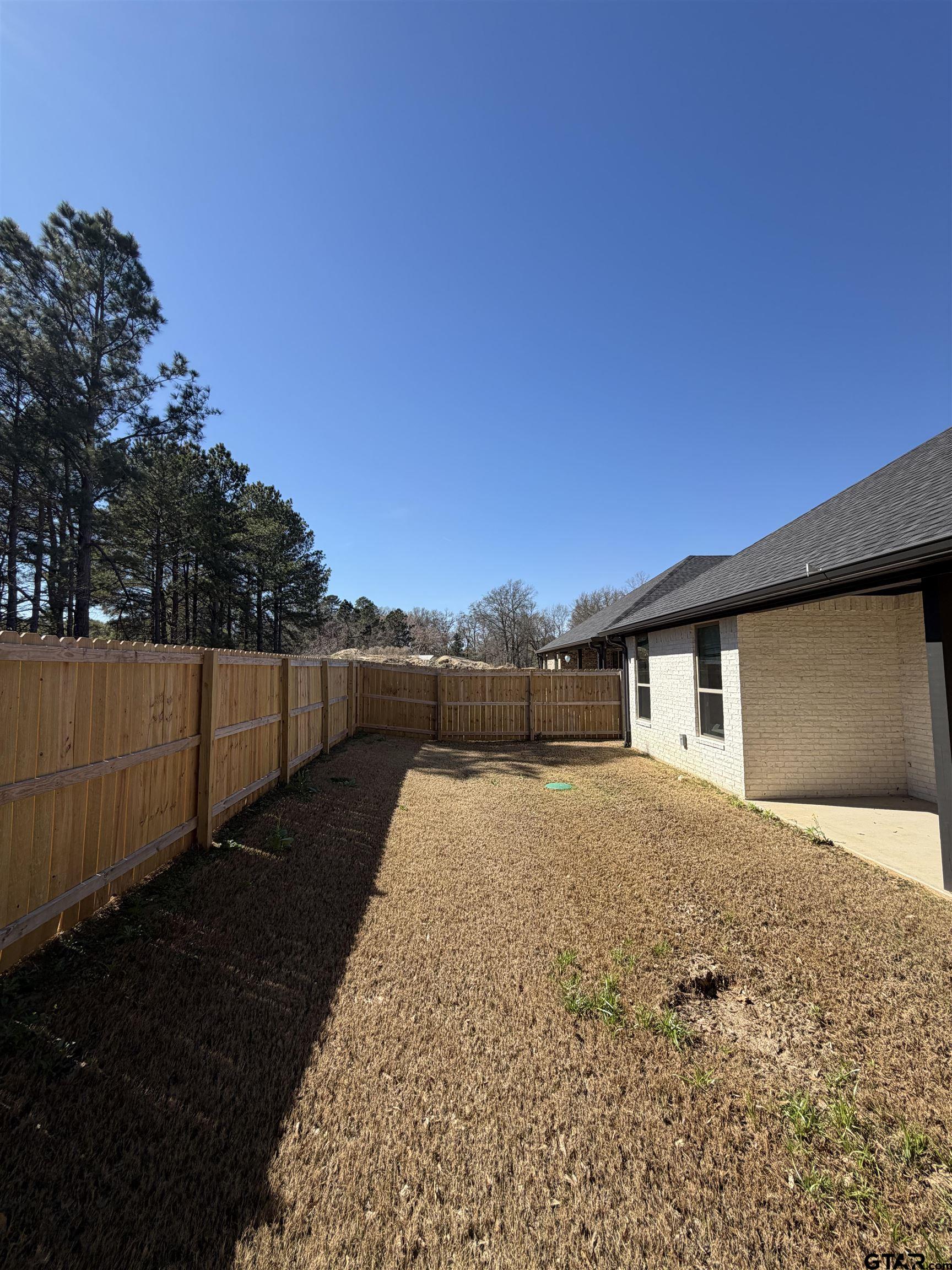 11201 County Road 166 Tyler, TX 75703 - Photo 19 of 19 a house view with a backyard