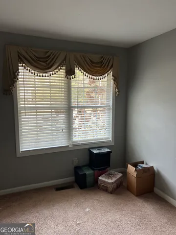 a room with a bed and a window