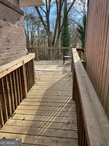 a view of outdoor space with deck and wooden floor