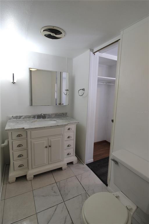 503 51st Avenue West, Unit 503 Bradenton, FL 34207 - Photo 11 of 19 a spacious bathroom with a granite countertop sink toilet and mirror