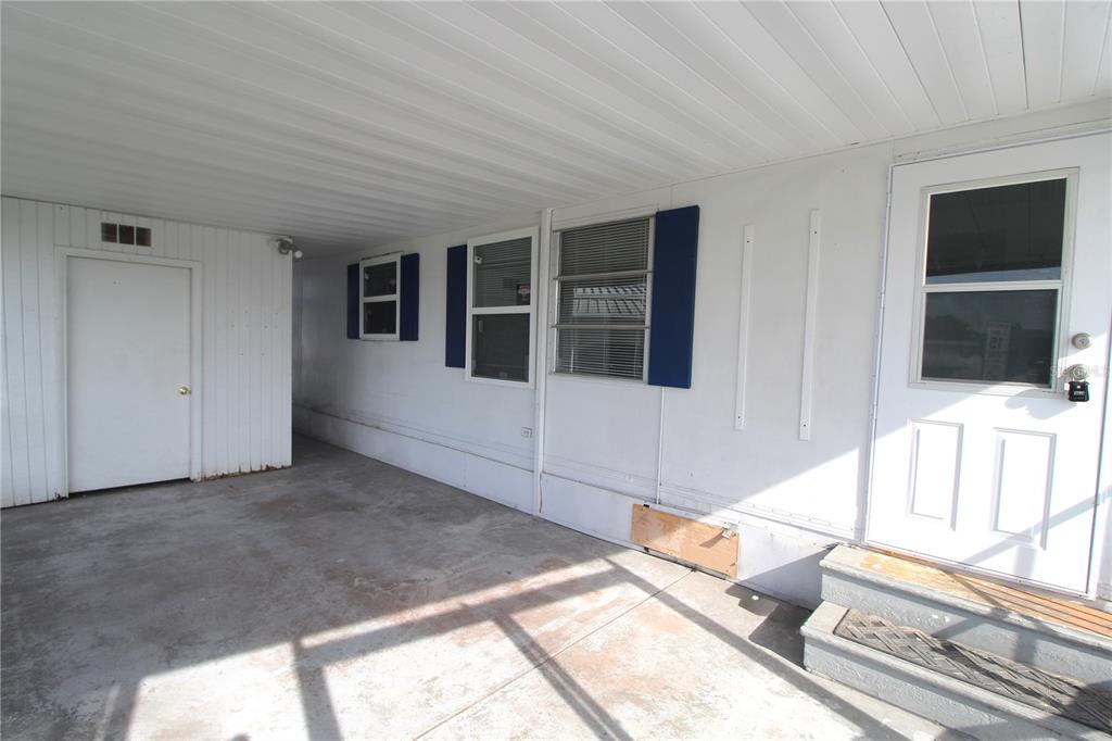 503 51st Avenue West, Unit 503 Bradenton, FL 34207 - Photo 17 of 19 a living room with a large window and a flat screen tv