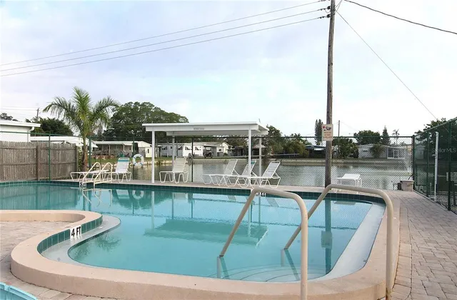 a view of a swimming pool with a lake view