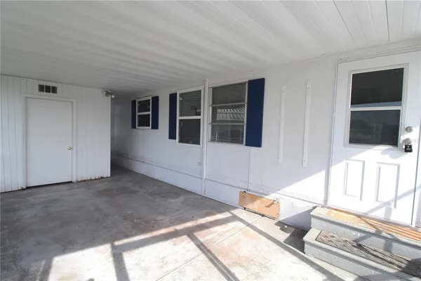a living room with a large window and a flat screen tv