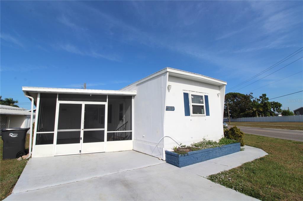 503 51st Avenue West, Unit 503 Bradenton, FL 34207 - Photo 2 of 19 a house view with a garden space