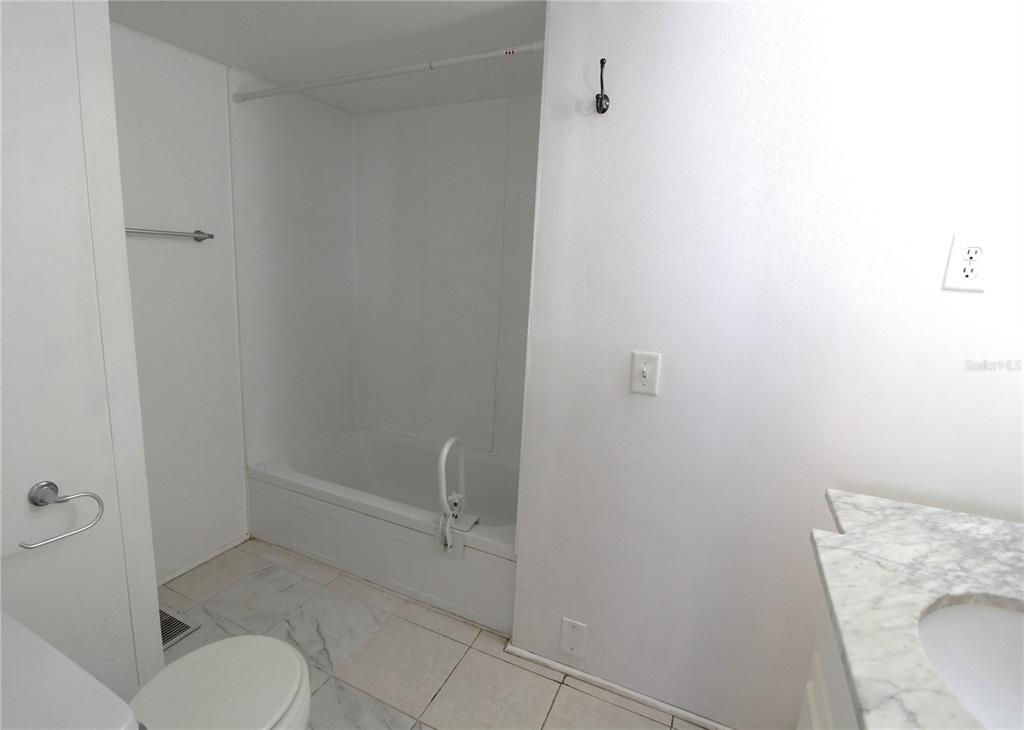 503 51st Avenue West, Unit 503 Bradenton, FL 34207 - Photo 10 of 19 a bathroom with a toilet