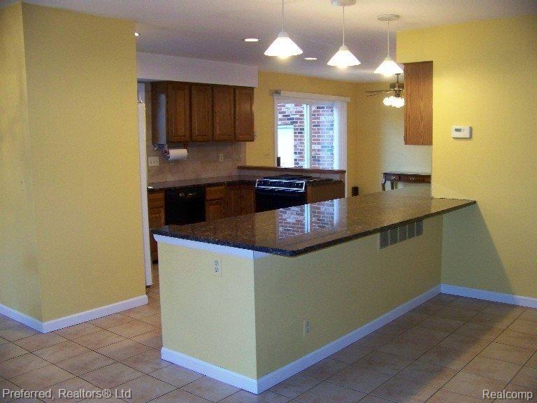 47100 Maben Road Canton, MI 48187 - Photo 15 of 23 Granite Surfaces w/ Snack Bar