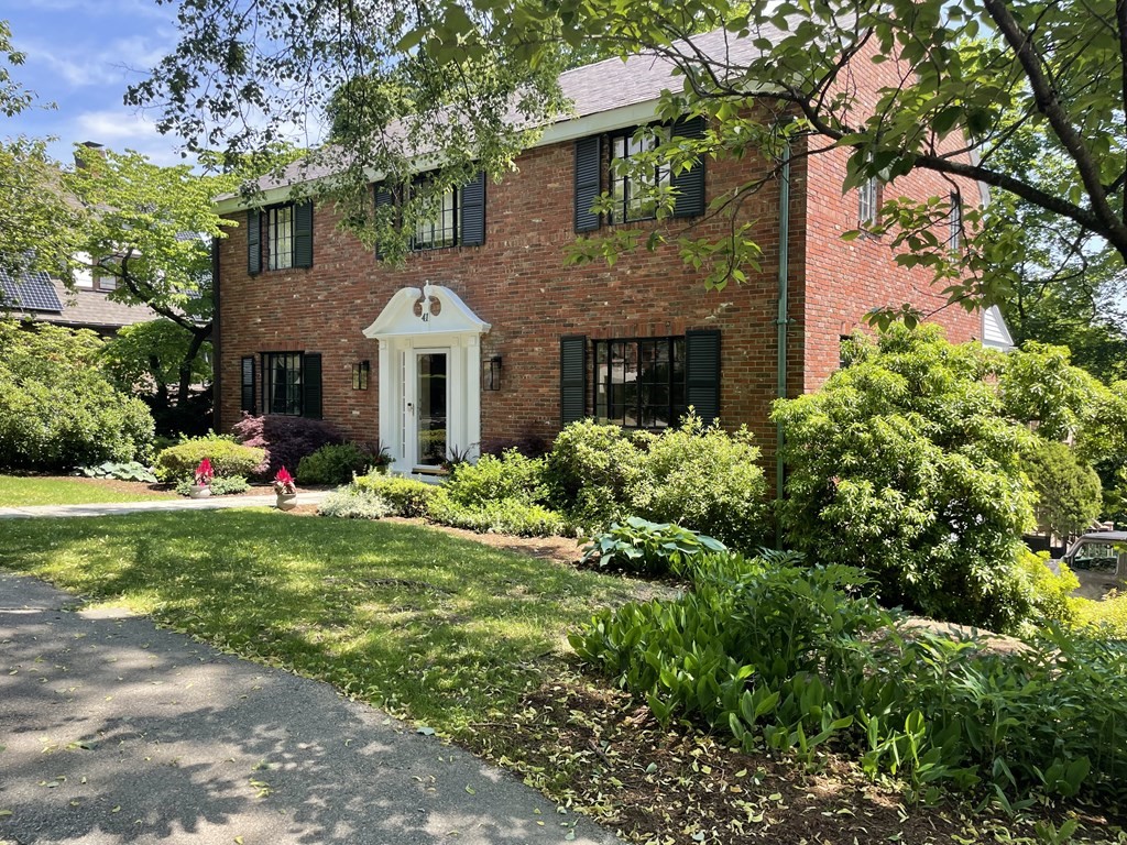 41 Goodnough Road Brookline, MA 02467 - Photo 1 of 36 a front view of a house with a yard and potted plants