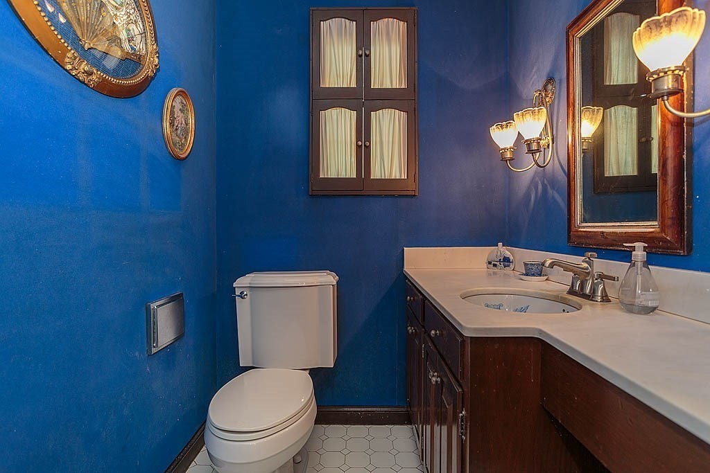 41 Goodnough Road Brookline, MA 02467 - Photo 16 of 36 a bathroom with a toilet sink vanity and mirror
