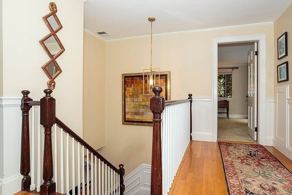 41 Goodnough Road Brookline, MA 02467 - Photo 17 of 36 a view of a hallway with wooden floor and staircase