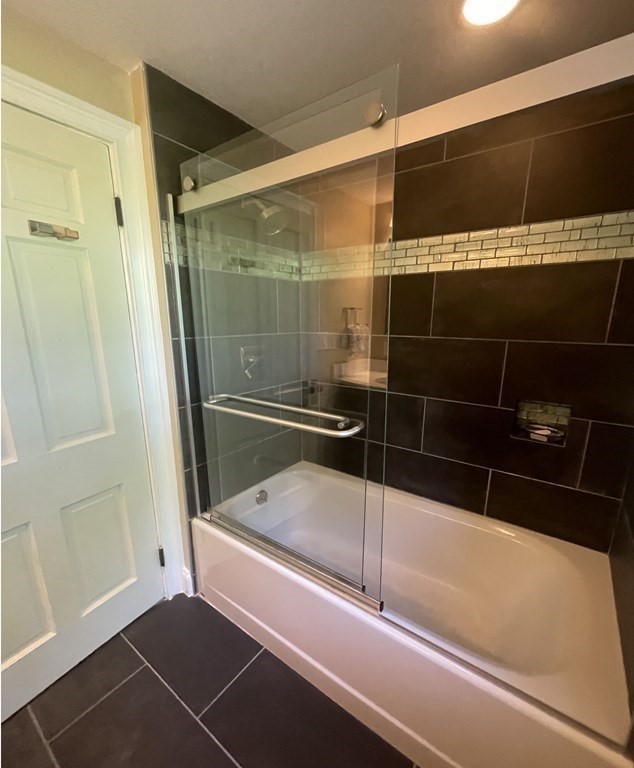 41 Goodnough Road Brookline, MA 02467 - Photo 20 of 36 a bathroom with a bathtub and a shower