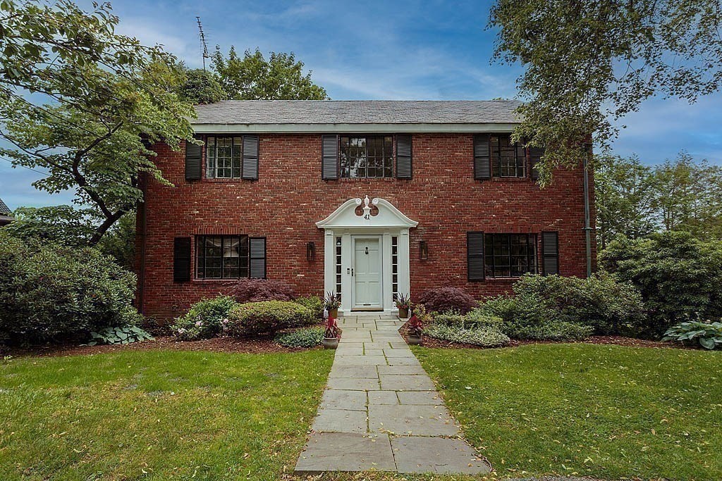 41 Goodnough Road Brookline, MA 02467 - Photo 32 of 36 a front view of a house with garden