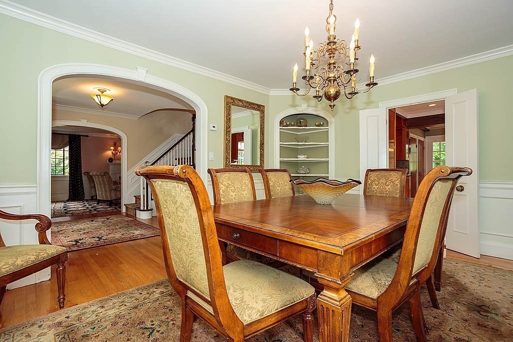 41 Goodnough Road Brookline, MA 02467 - Photo 5 of 36 a dining room with furniture a chandelier and window