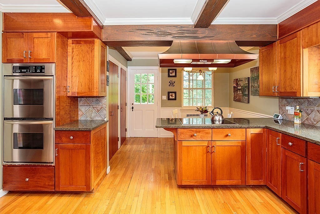 41 Goodnough Road Brookline, MA 02467 - Photo 6 of 36 a kitchen with stainless steel appliances granite countertop a stove a sink and a refrigerator