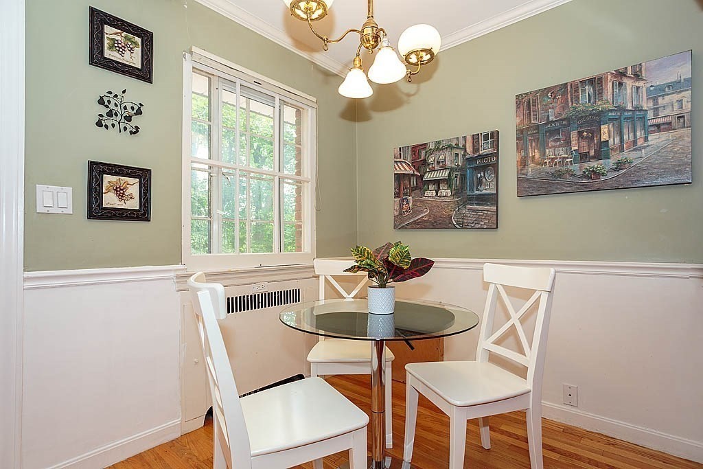 41 Goodnough Road Brookline, MA 02467 - Photo 9 of 36 a view of a dining room with furniture and a chandelier