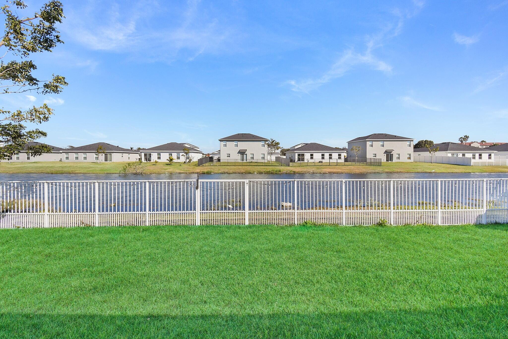 113 Dabou Loop Belle Glade, FL 33430 - Photo 21 of 22 a view of a city with ocean view