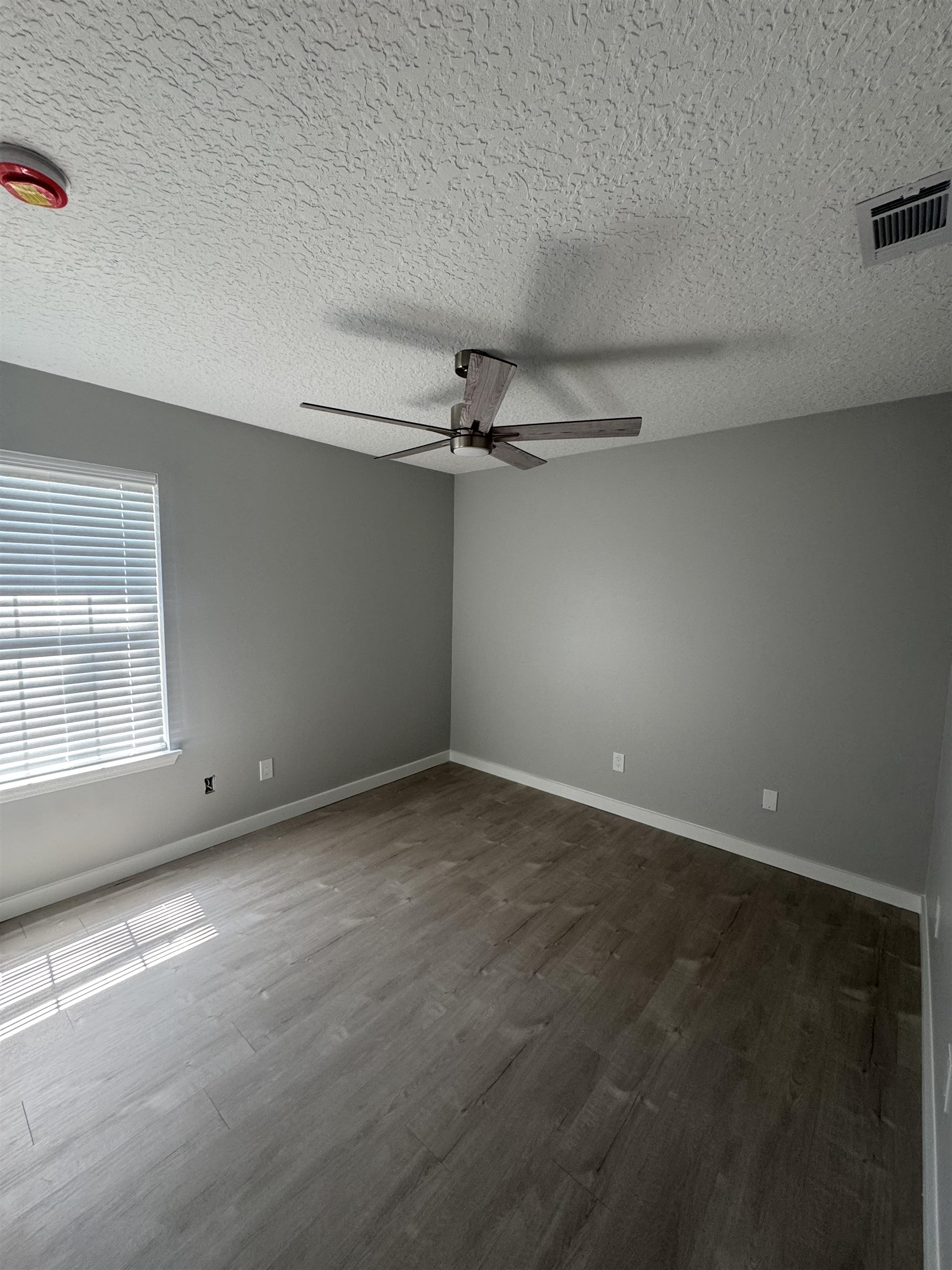 3372 9th Street Elkton, FL 32033 - Photo 11 of 17 an empty room with a empty space and windows