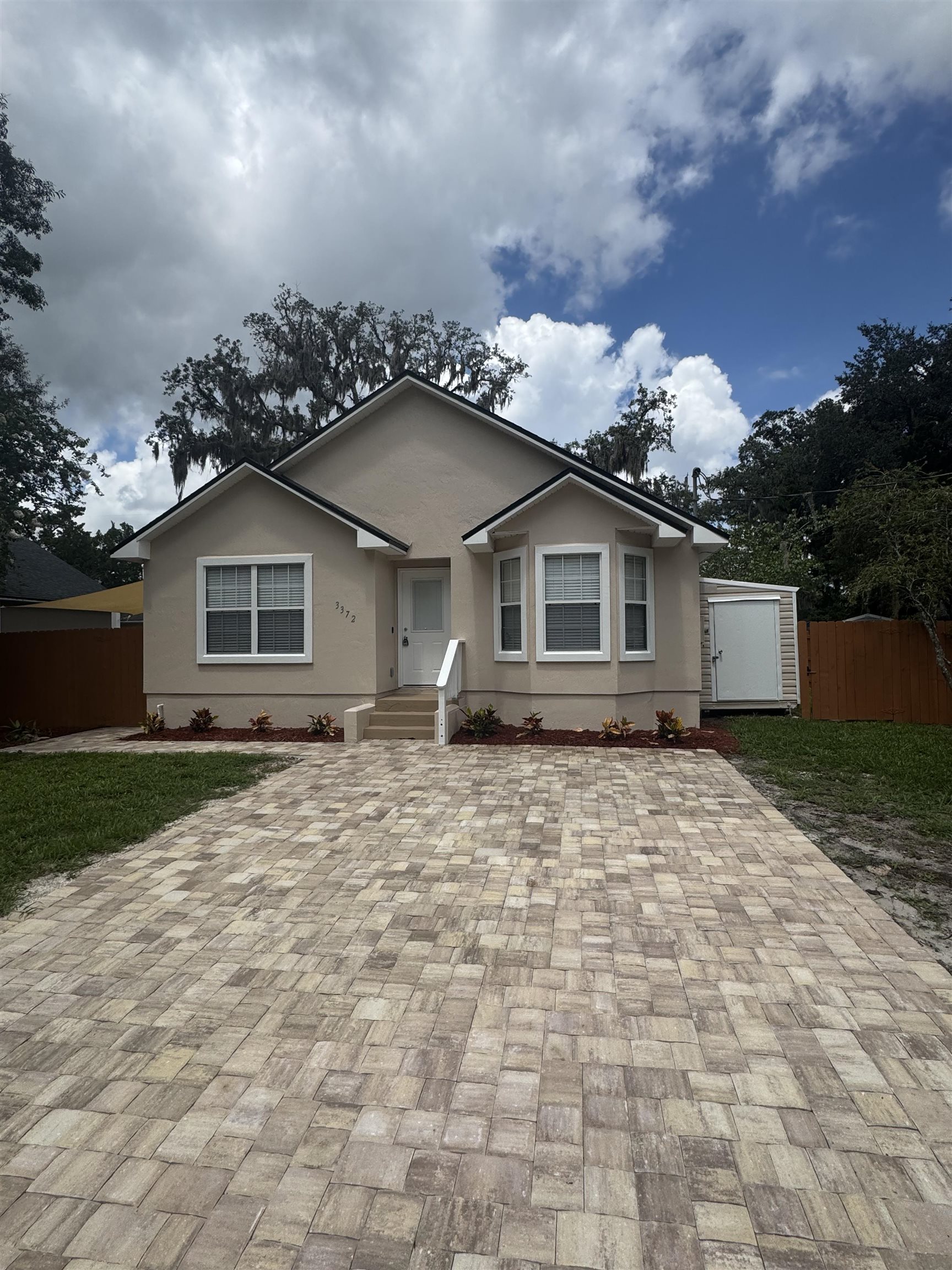 3372 9th Street Elkton, FL 32033 - Photo 2 of 17 a backyard of a house with lots of green space