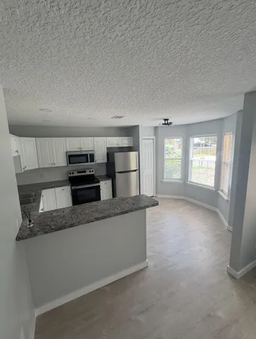 a view of a kitchen with a sink