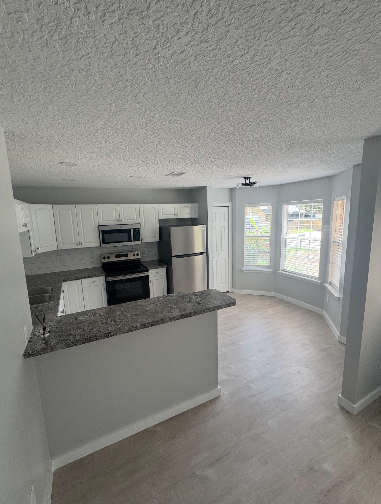 3372 9th Street Elkton, FL 32033 - Photo 3 of 17 a view of a kitchen with a sink