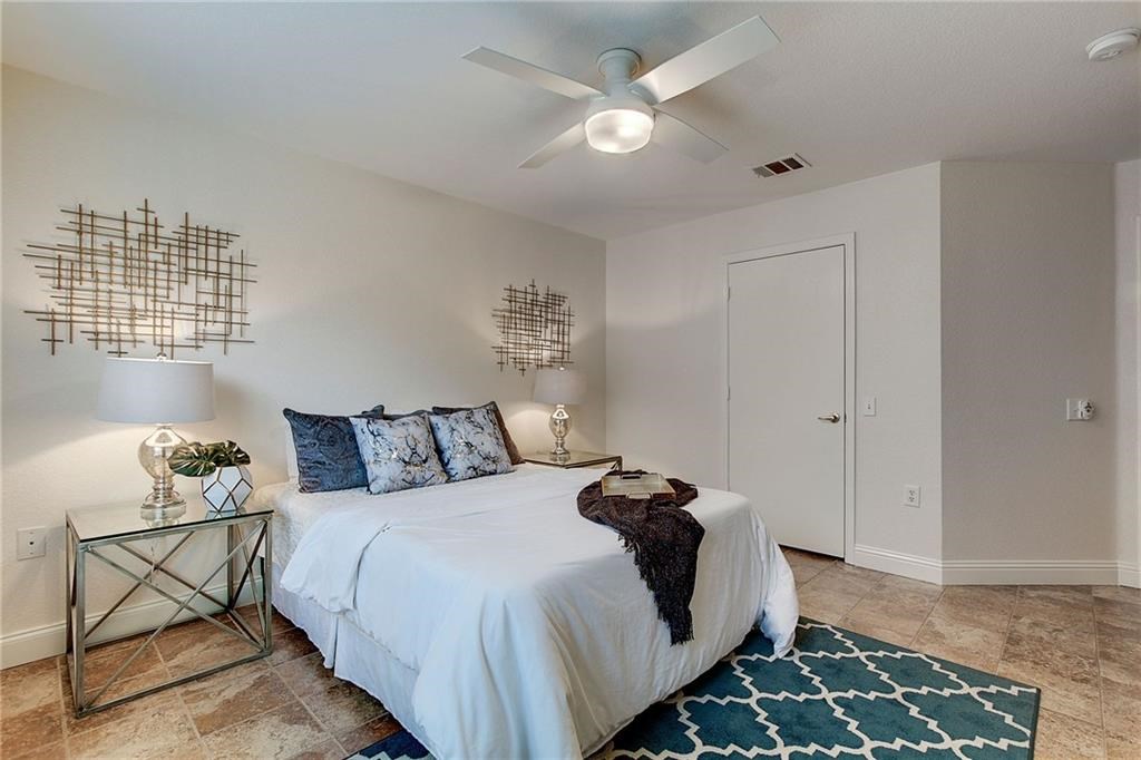 7107 Alegre Pass Austin, TX 78744 - Photo 12 of 20 a bed room with a bed and a window