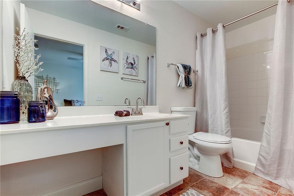 7107 Alegre Pass Austin, TX 78744 - Photo 13 of 20 a bathroom with a sink toilet and shower