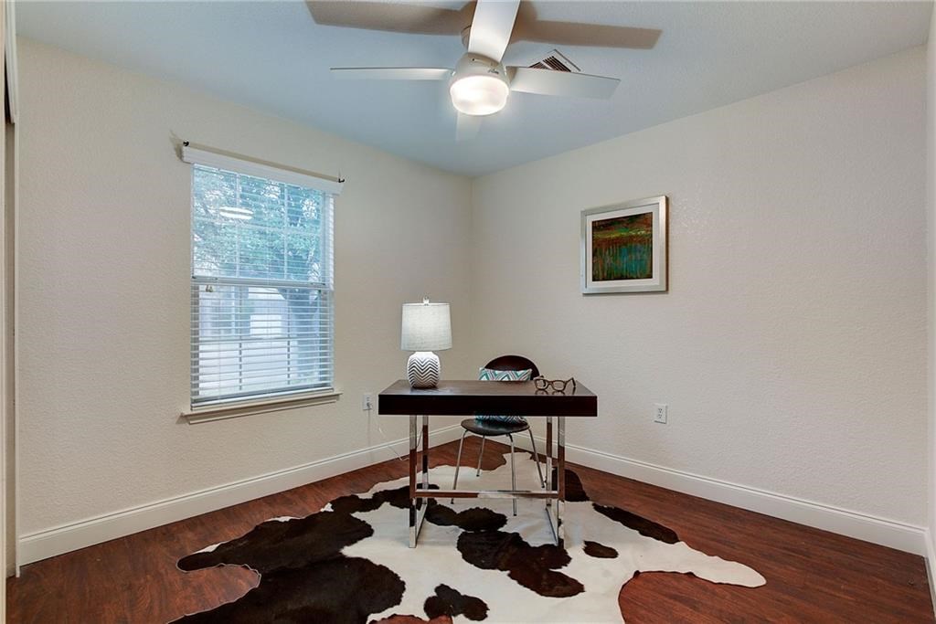 7107 Alegre Pass Austin, TX 78744 - Photo 14 of 20 a workspace with furniture and wooden floor