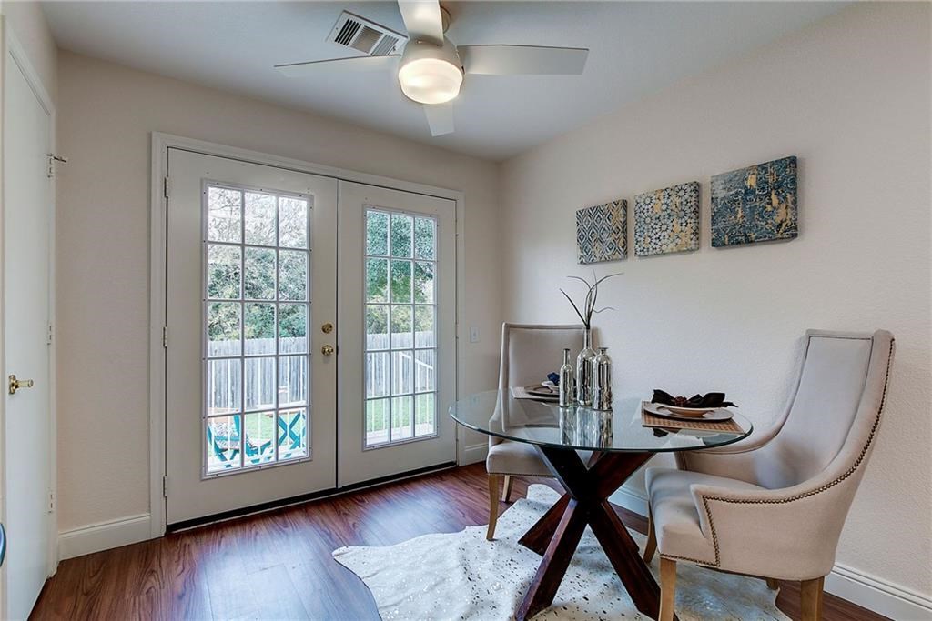 7107 Alegre Pass Austin, TX 78744 - Photo 10 of 20 a view of a dining room with furniture window and wooden floor