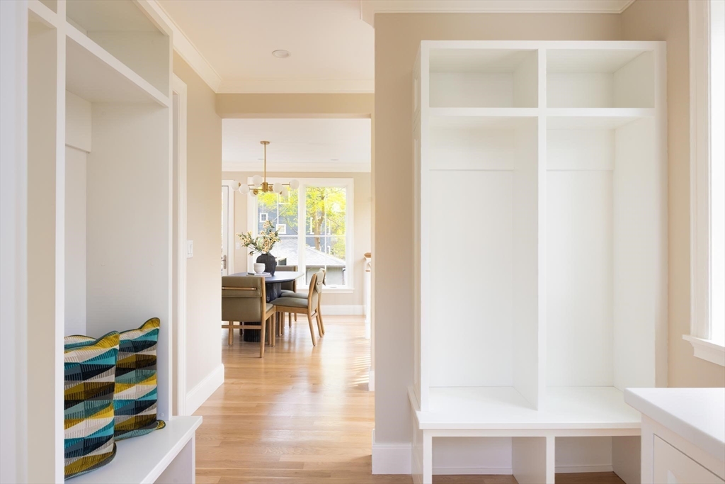 15 Woodcliff Road Newton, MA 02461 - Photo 12 of 27 a view of a hallway with wooden floor and a window