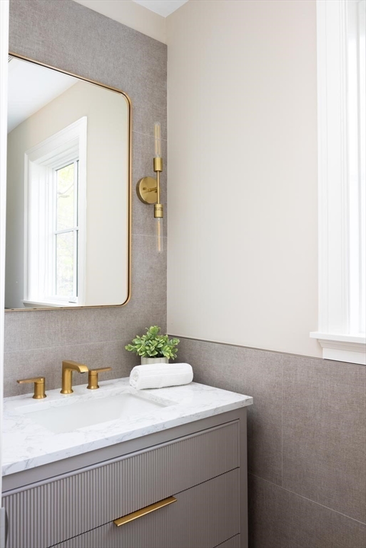 15 Woodcliff Road Newton, MA 02461 - Photo 13 of 27 a bathroom with a sink and a mirror