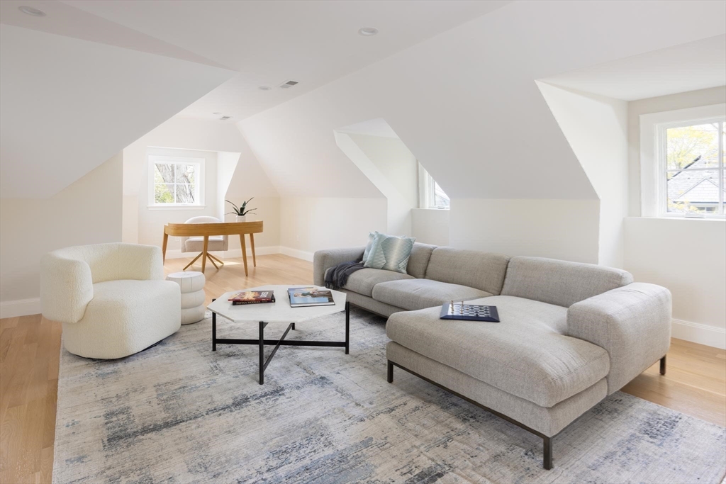 15 Woodcliff Road Newton, MA 02461 - Photo 19 of 27 a living room with furniture and a large window