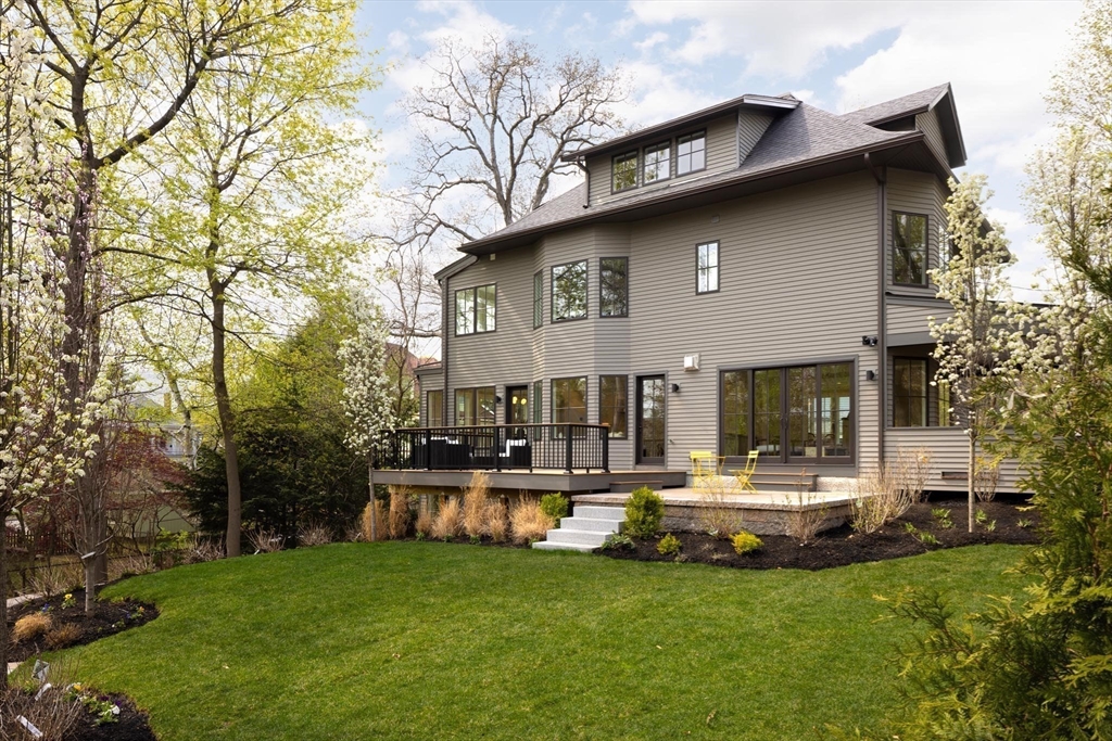 15 Woodcliff Road Newton, MA 02461 - Photo 24 of 27 a view of a house with patio and a yard